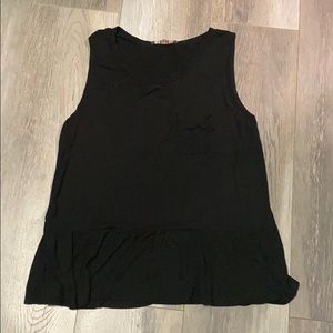 Black sleeveless top.